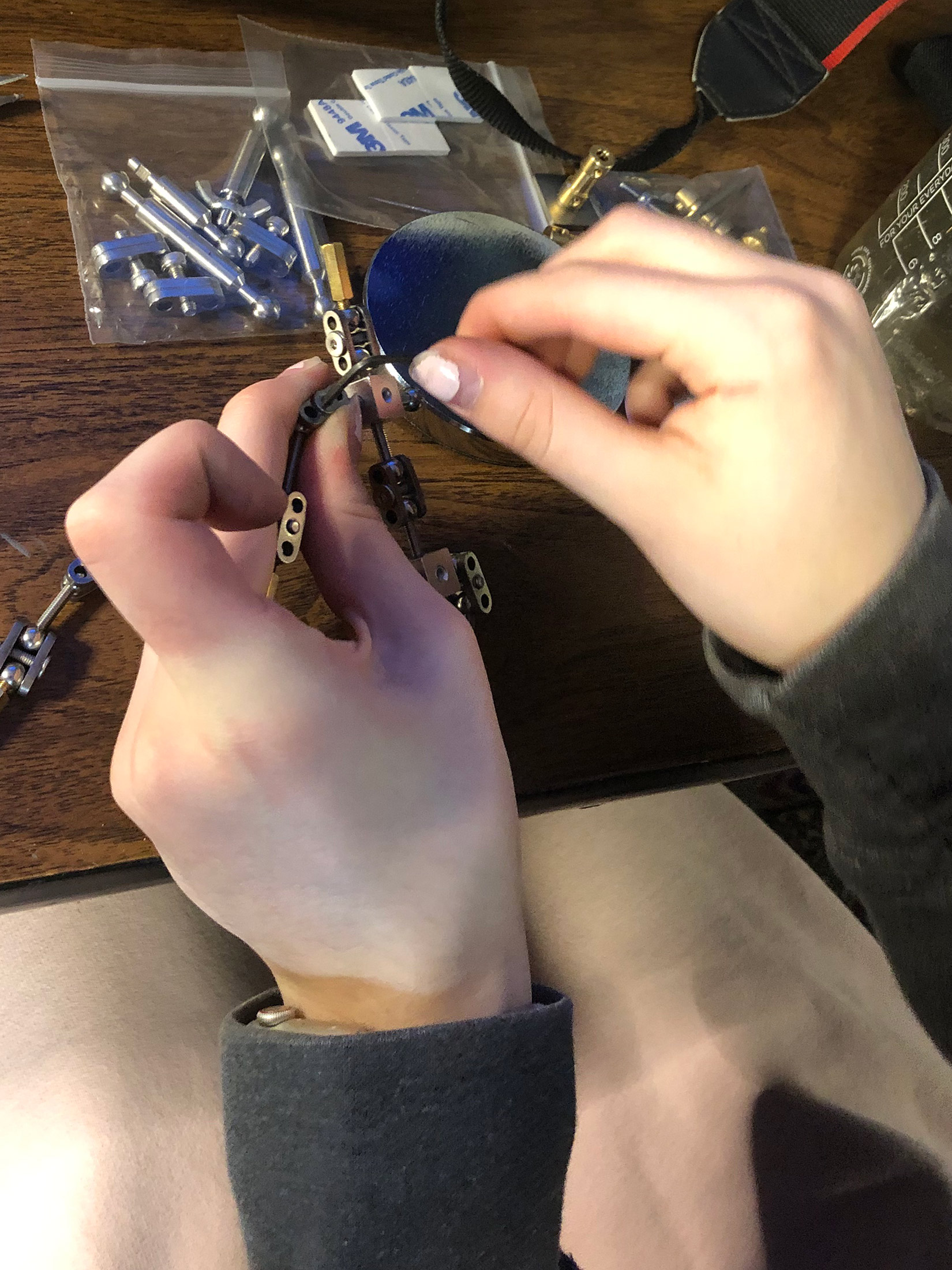 Animation student Marion assembling her new stop motion ball and socket armature project. Workshops by The Clayman Studio. The image captures the hands-on creative process of character design and animation production.