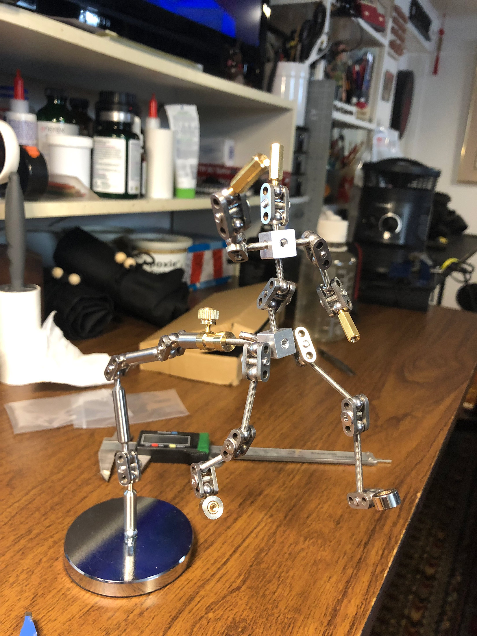 Animation student Marion assembling her new stop motion ball and socket armature project. Workshops by The Clayman Studio. The image captures the hands-on creative process of character design and animation production.